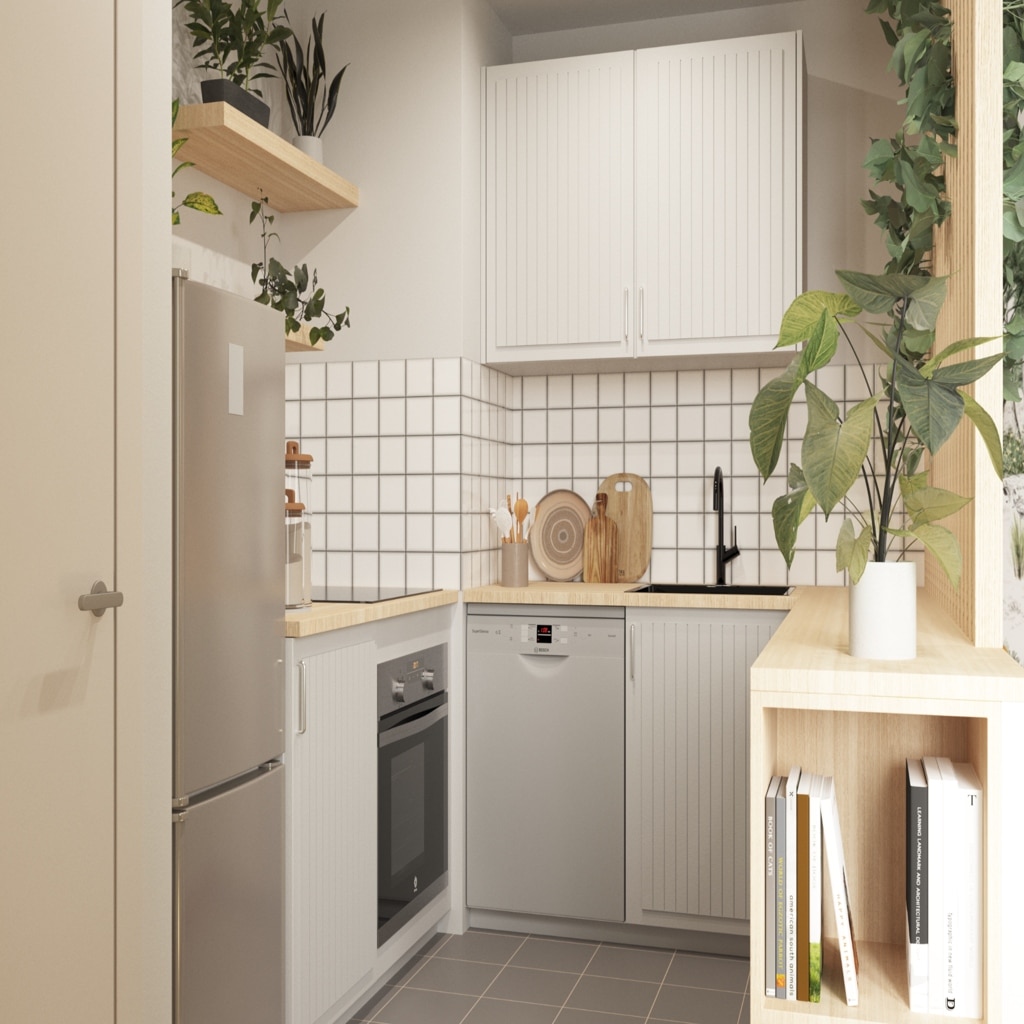 Cuisine ikea rénové pour un studio parisien avec beaucoup de plantes vertes.